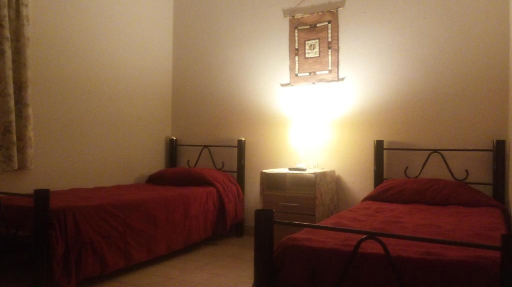 Cama o camas de una habitación en Hospedaje La Serranita