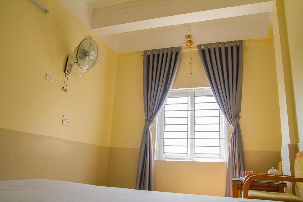 Postel nebo postele na pokoji v ubytování Phương Phương 2 Hotel