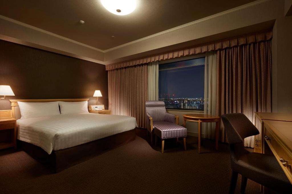 Postel nebo postele na pokoji v ubytování Hotel Agora Regency Osaka Sakai