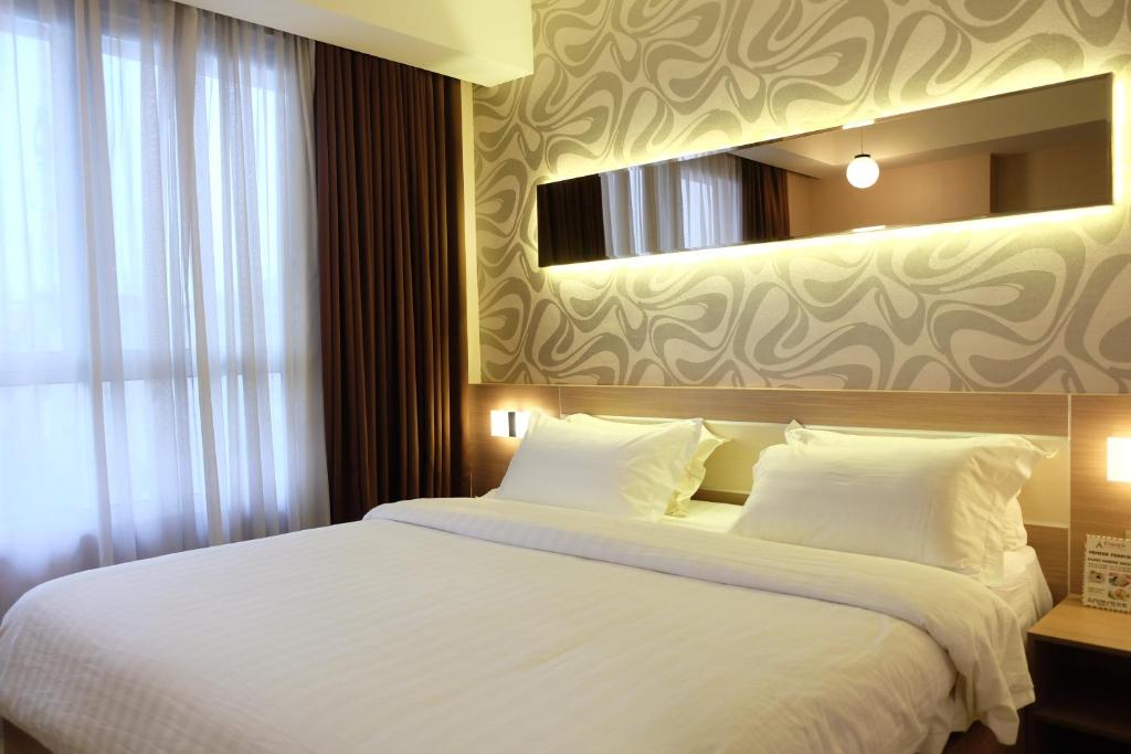 Postel nebo postele na pokoji v ubytování Classie Hotel