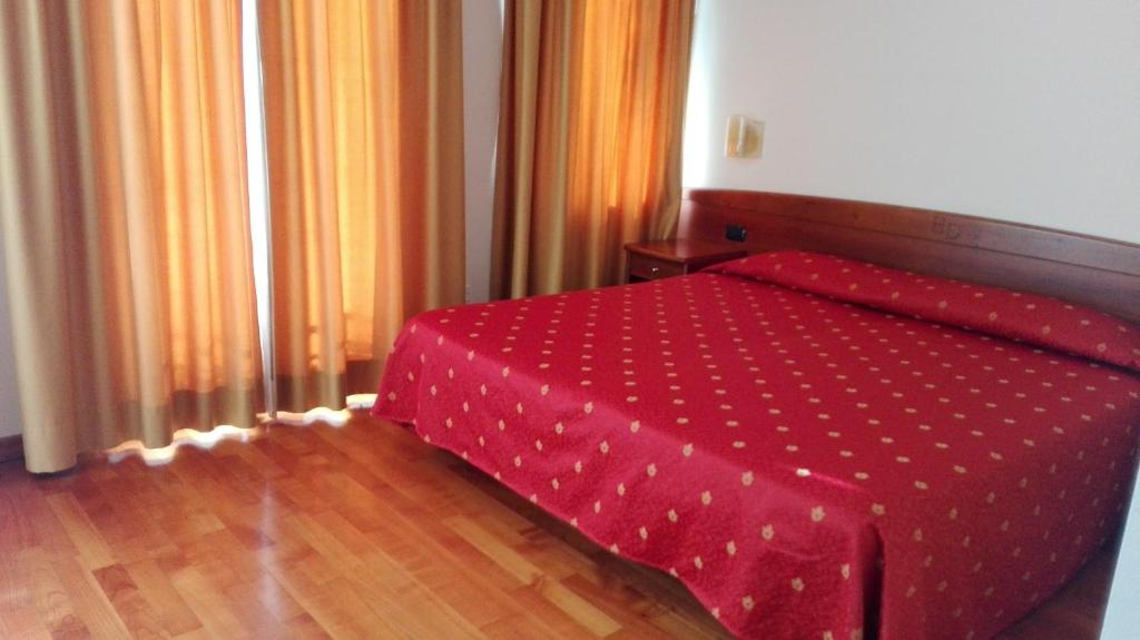 Postel nebo postele na pokoji v ubytování Hotel Dall'Ongaro