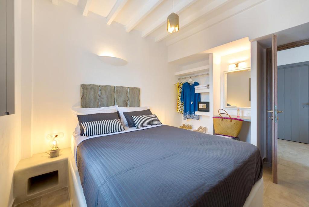 Postel nebo postele na pokoji v ubytování White Harmony Suites