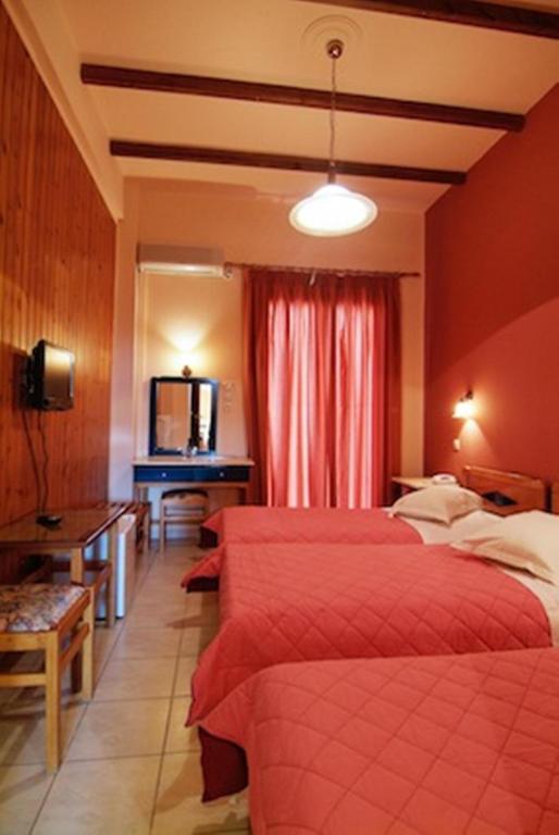 Postel nebo postele na pokoji v ubytování Hotel Varonos