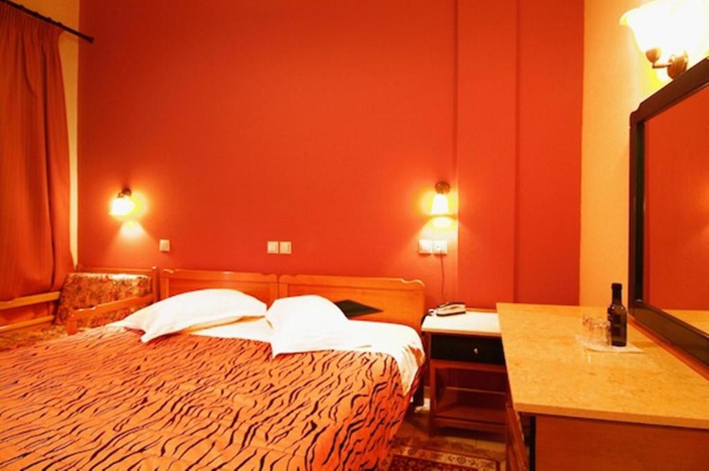 Postel nebo postele na pokoji v ubytování Hotel Varonos