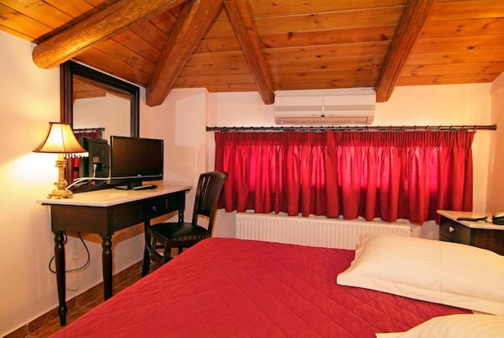 Postel nebo postele na pokoji v ubytování Hotel Varonos