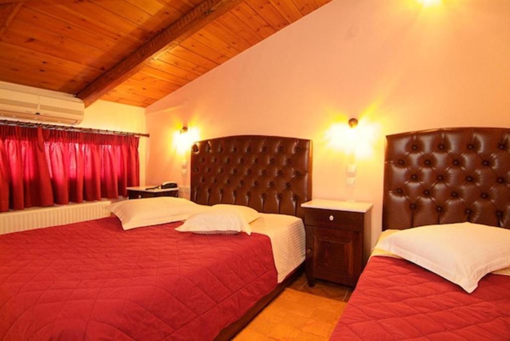 Postel nebo postele na pokoji v ubytování Hotel Varonos