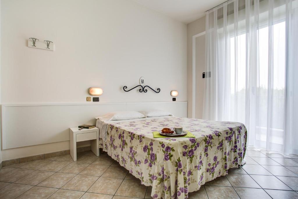 Postel nebo postele na pokoji v ubytování Ancora Hotel & Residence