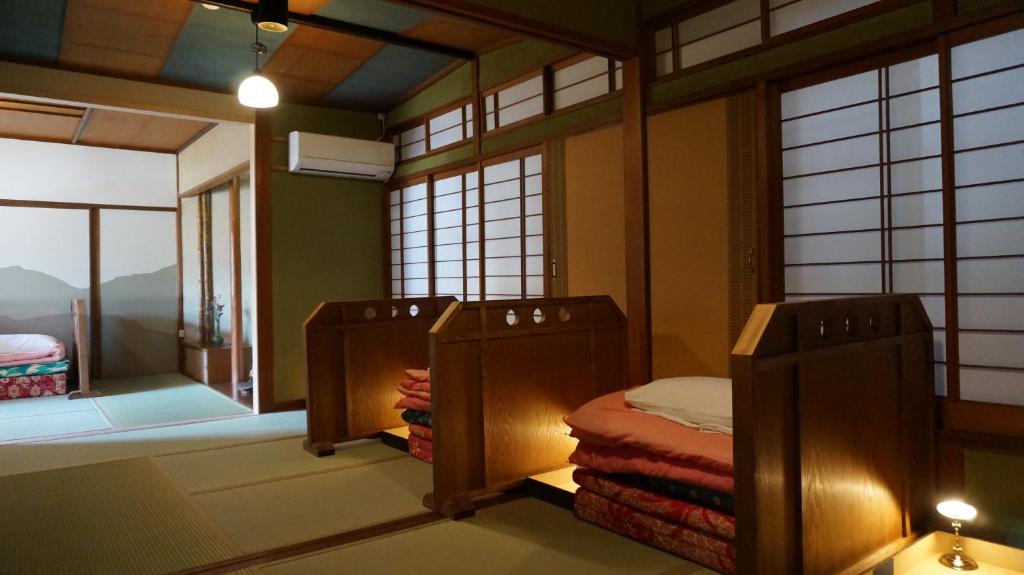 Postel nebo postele na pokoji v ubytování Japanese Guesthouse Kinosaki Wakayo (Female Only)