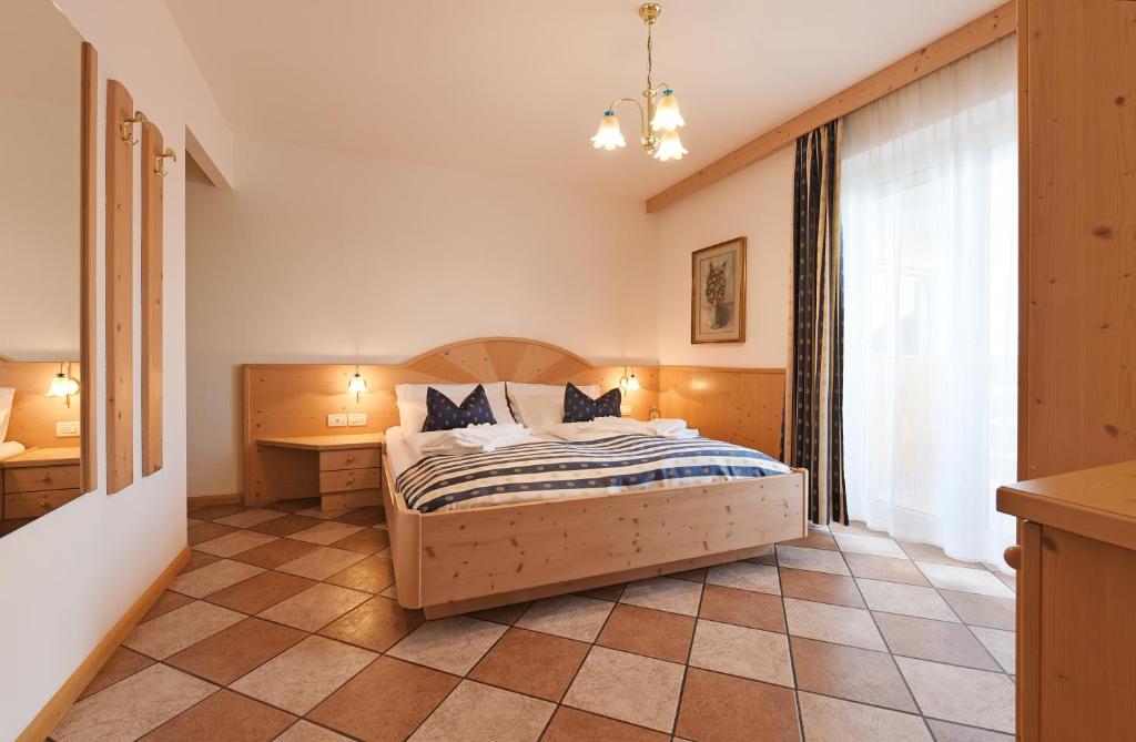 Postel nebo postele na pokoji v ubytování Alpin-Residence Amadeus