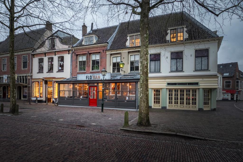 a building on a street in a city at Hotel Brasserie Florian in Wijk bij Duurstede