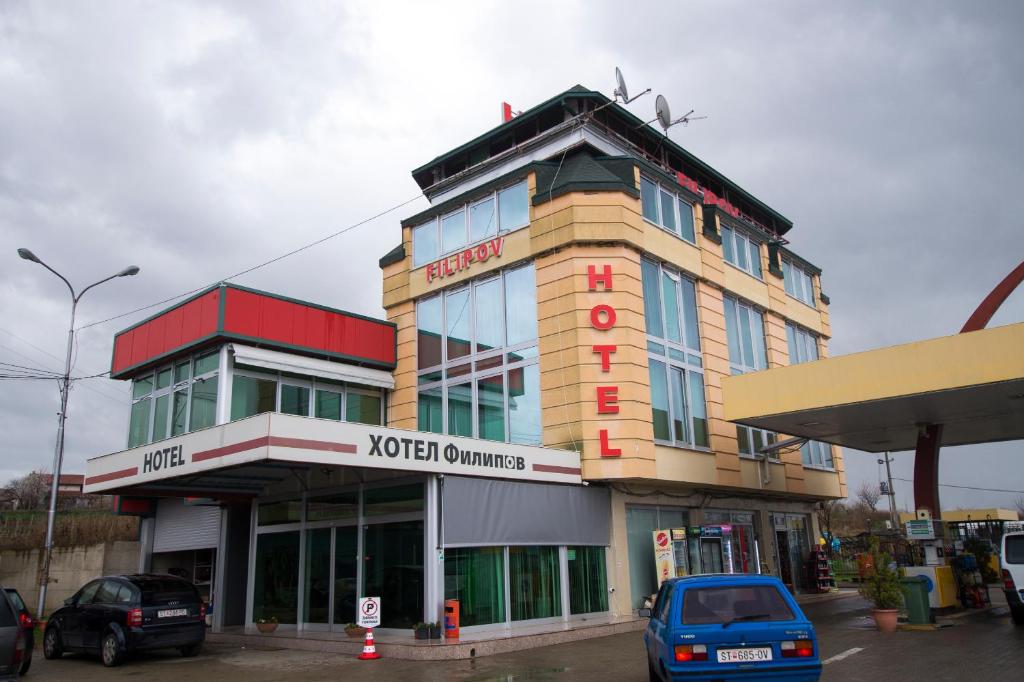 a building with a hotel sign on top of it at Hotel Filipov in Kočani