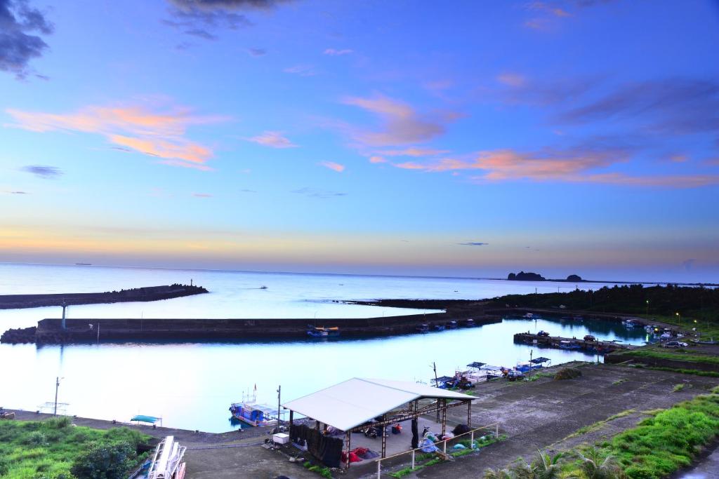 a view of a body of water with a dock at Sansendai Sea View B&amp;B in Chenggong