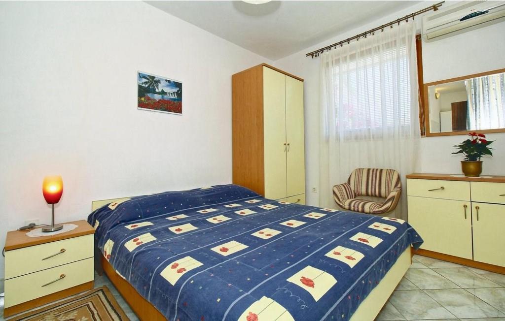 Postel nebo postele na pokoji v ubytování Apartments Novacic
