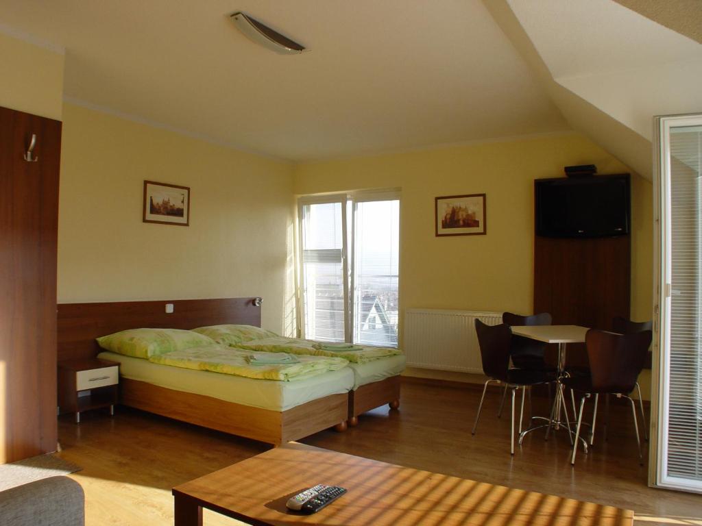 Postel nebo postele na pokoji v ubytování Apartmany Hujer