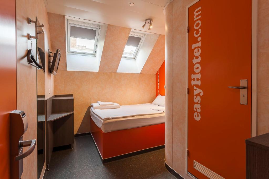 a small room with a small bed in it at easyHotel Budapest Oktogon in Budapest