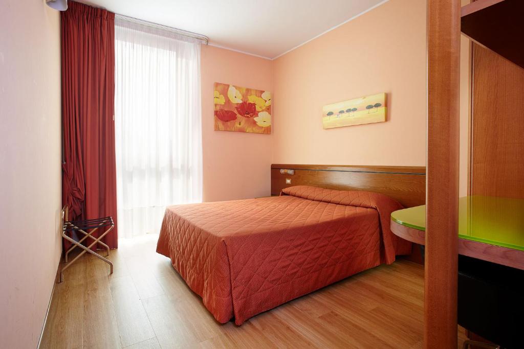 Postel nebo postele na pokoji v ubytování Primhotel