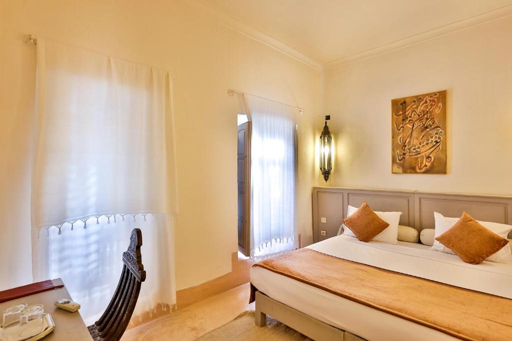Postel nebo postele na pokoji v ubytování Hotel & Spa Riad Al Jazira