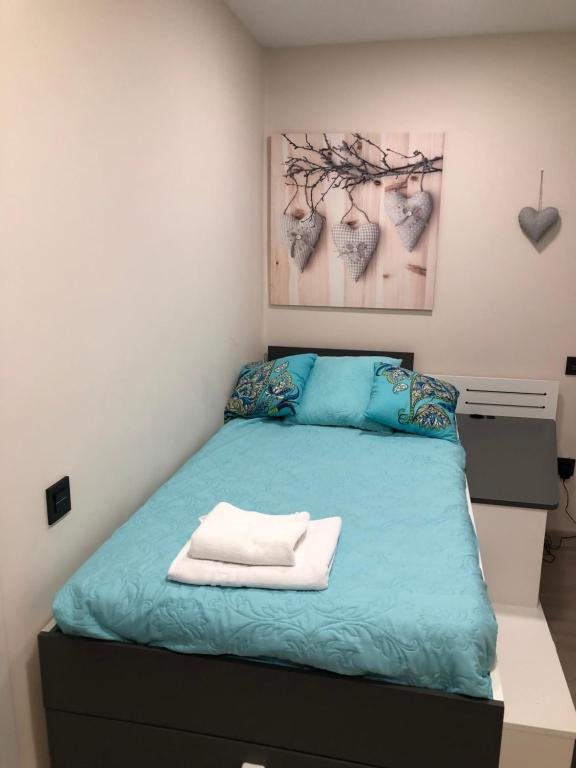 A bed or beds in a room at Madala XXI
