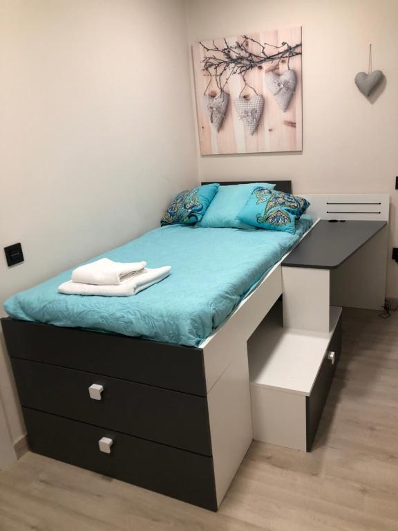 A bed or beds in a room at Madala XXI