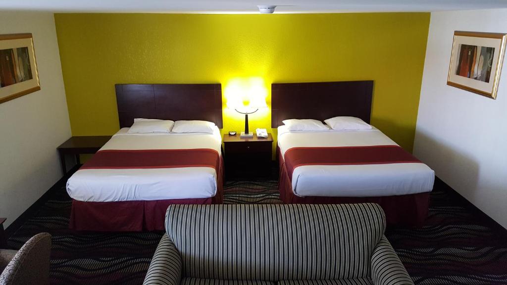 Postel nebo postele na pokoji v ubytování Horizon Inn