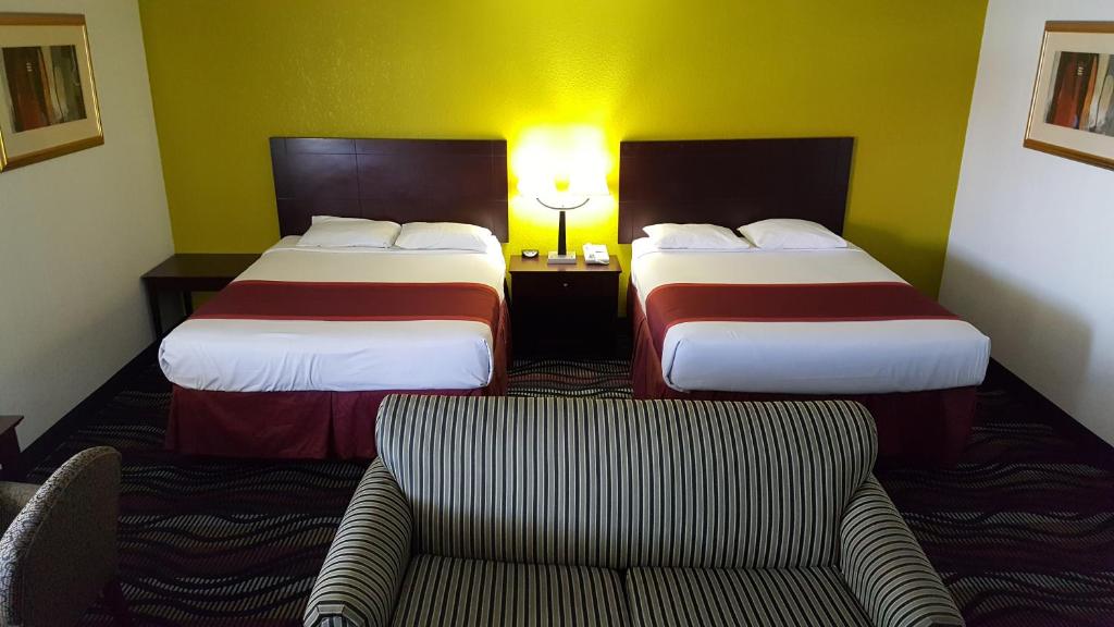 Postel nebo postele na pokoji v ubytování Horizon Inn