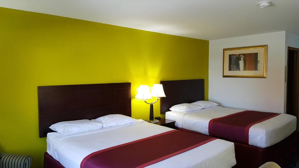 Postel nebo postele na pokoji v ubytování Horizon Inn