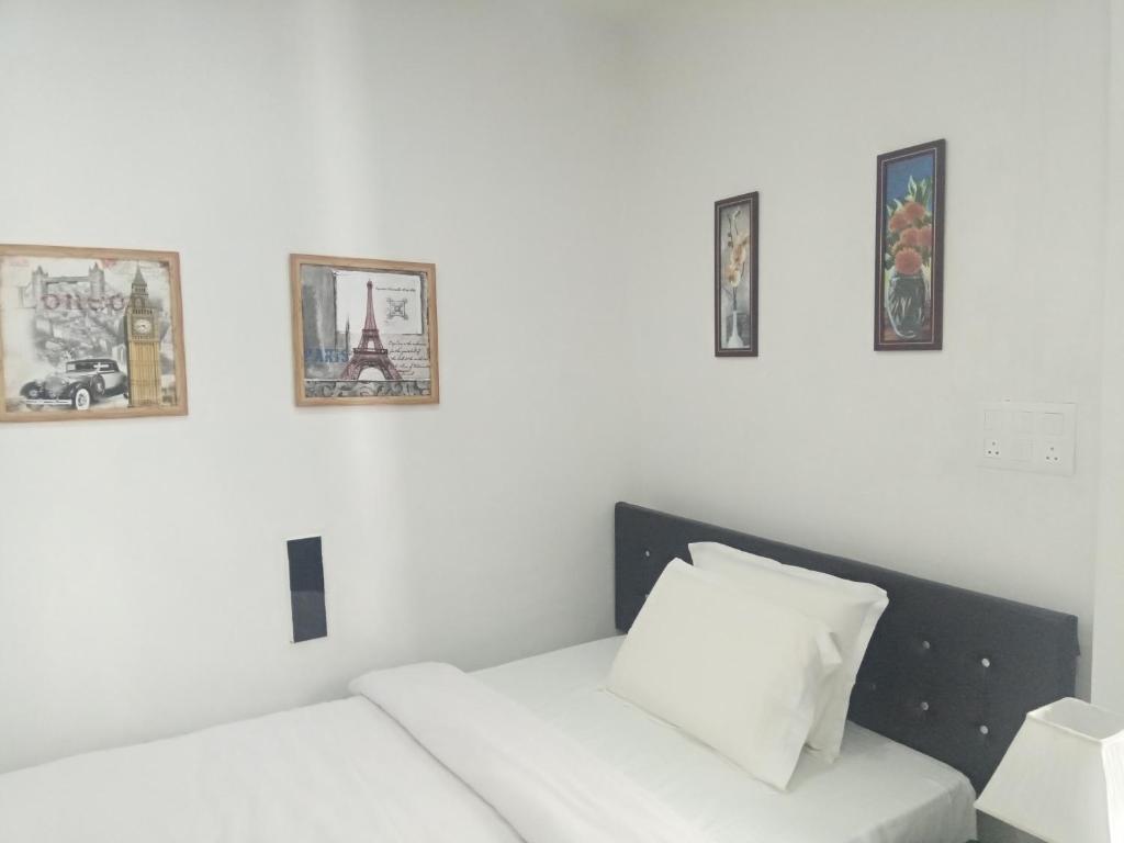 Postel nebo postele na pokoji v ubytování J. I. T HOTEL