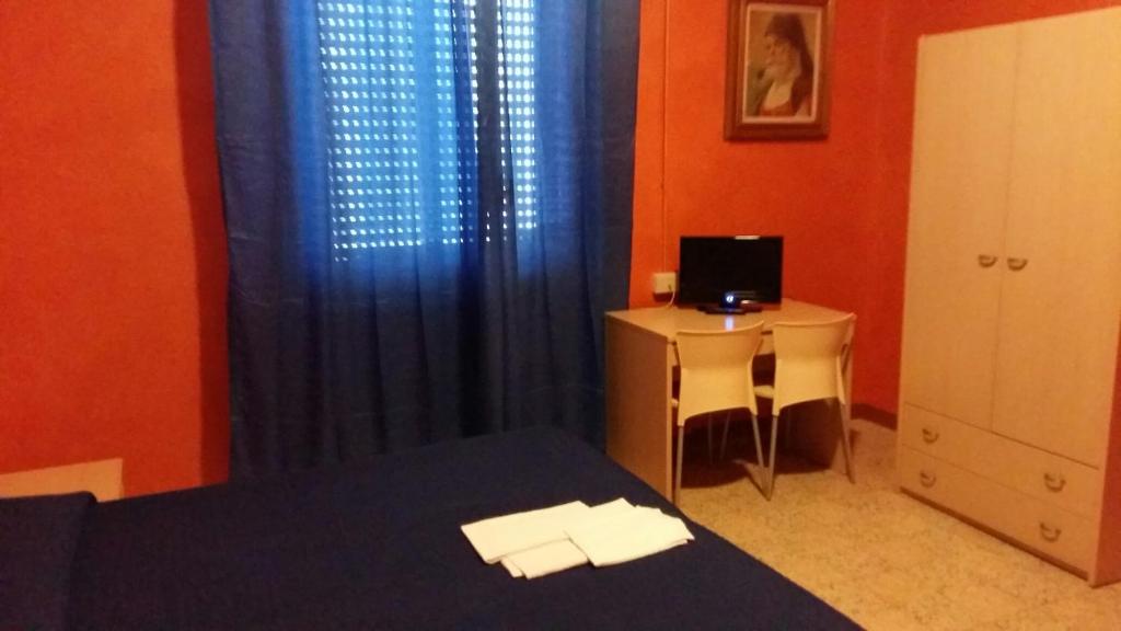 Postel nebo postele na pokoji v ubytování Hotel Violetta
