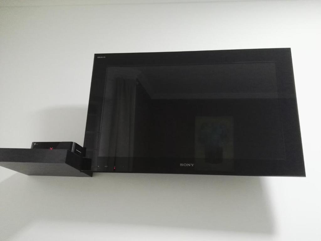 Televízia a/alebo spoločenská miestnosť v ubytovaní Nyirjes Vendégház