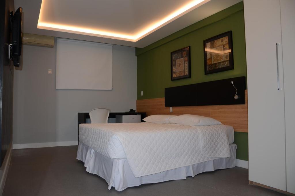 Postel nebo postele na pokoji v ubytování Hotel São Domingos