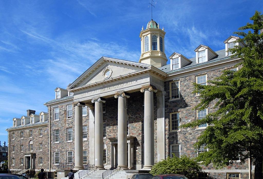 a large brick building with a tower on top of it at University of King's College in Halifax