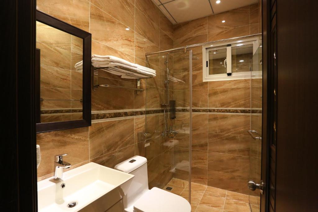 Koupelna v ubytování ChangJu Hotel-附免費停車位
