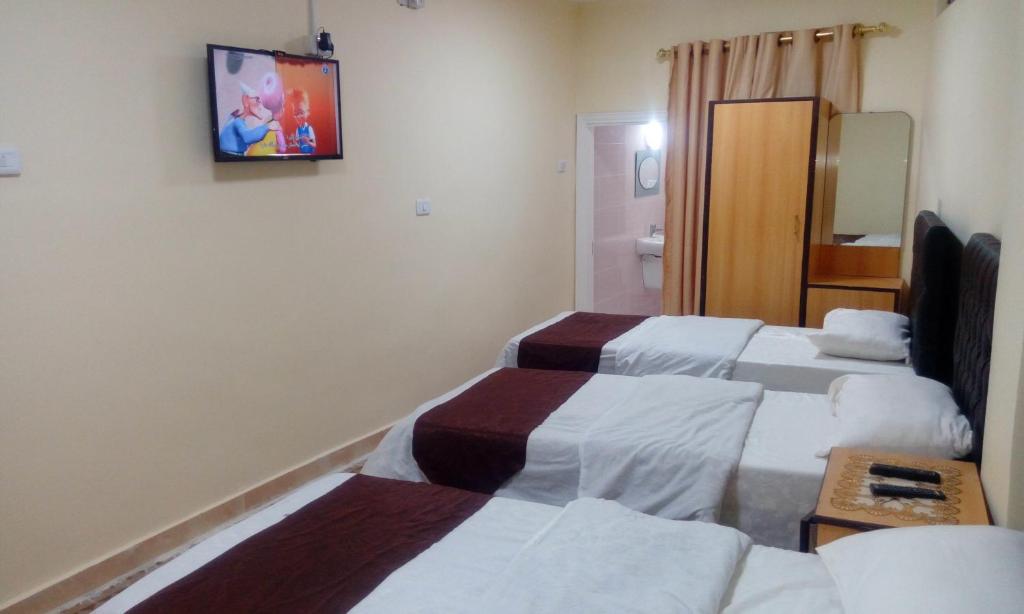 Posteľ alebo postele v izbe v ubytovaní Hamoudah Hotel