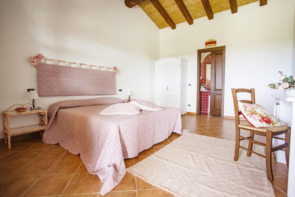 Postel nebo postele na pokoji v ubytování Villamarina Garden Relais