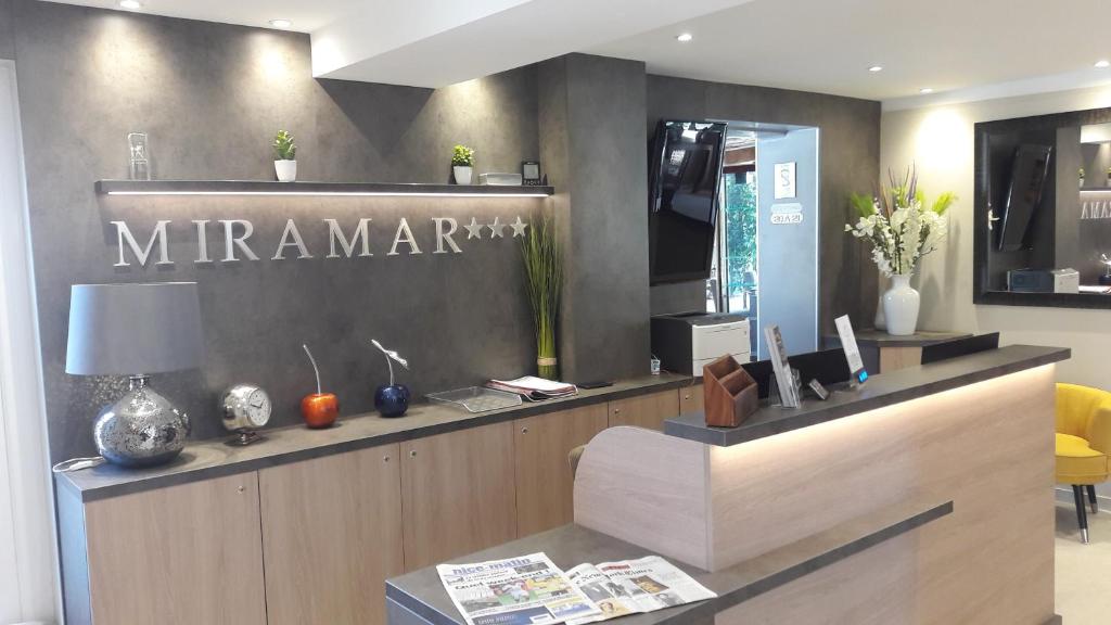 aarmaarma store with a sign on the wall at Hotel Miramar- Cap d'Antibes - La Garoupe plage in Antibes
