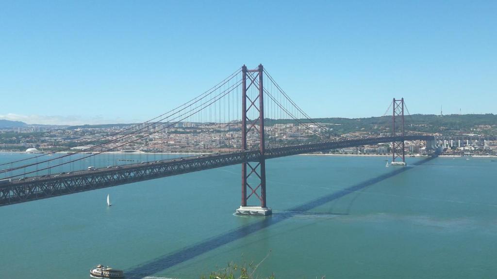 a bridge over a large body of water at modern flat in Estoril