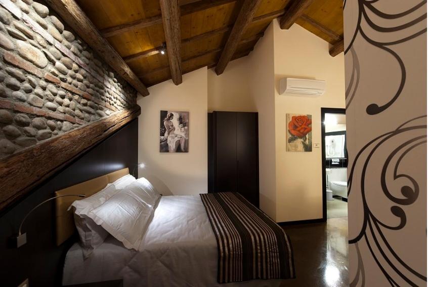 Postel nebo postele na pokoji v ubytování Villa Solaris Hotel & Residence