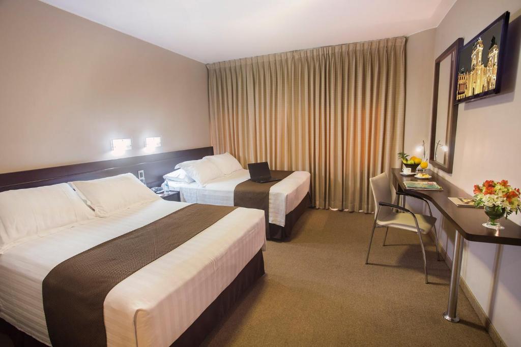 Postel nebo postele na pokoji v ubytování Del Pilar Miraflores Hotel