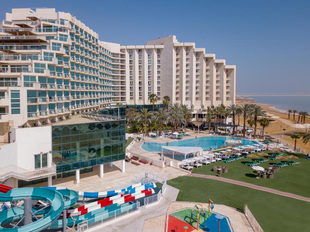 an aerial view of a resort with a water park at Leonardo Club Hotel Dead Sea - All Inclusive in Ein Bokek