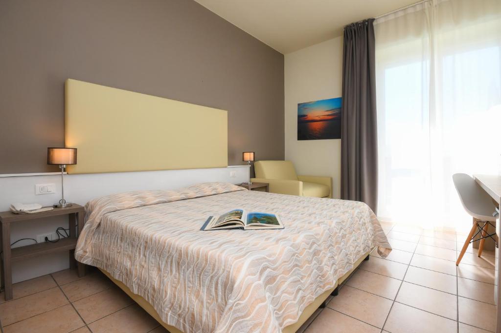 Postel nebo postele na pokoji v ubytování Hotel Miramar