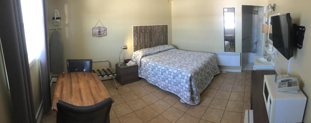 Postel nebo postele na pokoji v ubytování Motel Exquise