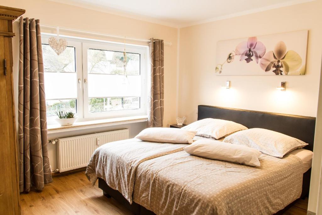 a bedroom with a bed with two pillows on it at Haus Burgfee - Obere Etage in Cochem