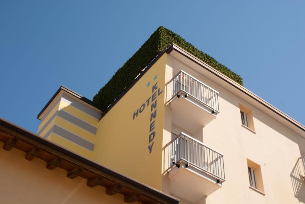 a building with balconies on the side of it at Hotel Kennedy in Caorle