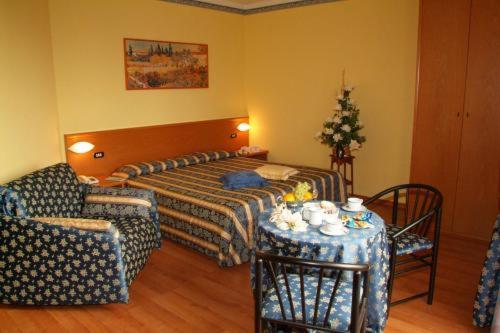 Postel nebo postele na pokoji v ubytování Hotel Le Mura e Residence