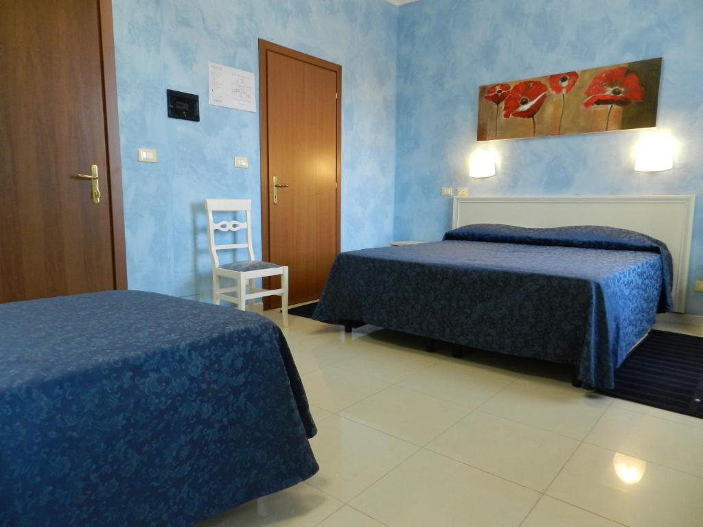 A bed or beds in a room at Hotel Air Palace Lingotto