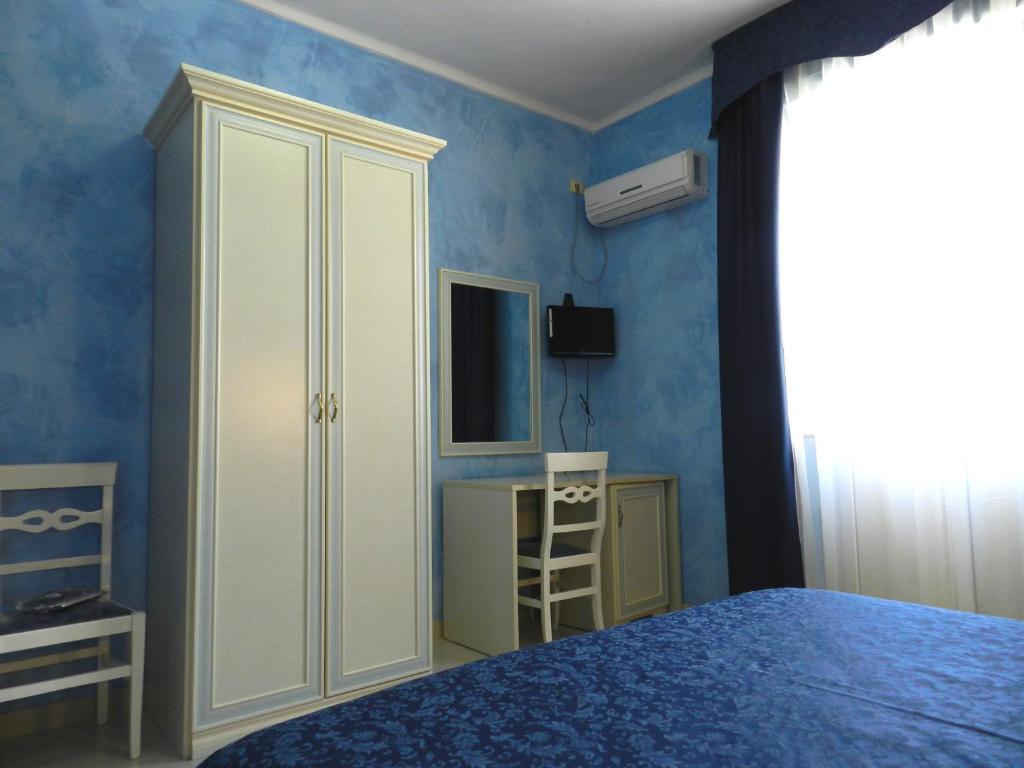 A bed or beds in a room at Hotel Air Palace Lingotto