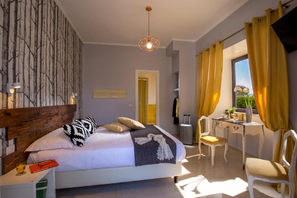 Postel nebo postele na pokoji v ubytování Urban Garden Hotel