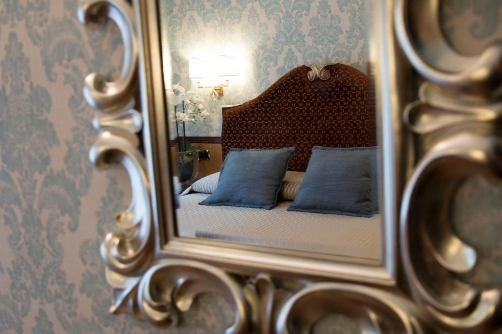 Postel nebo postele na pokoji v ubytování Hotel Europa