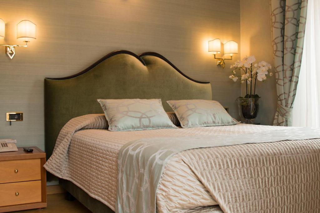 Postel nebo postele na pokoji v ubytování Hotel Europa