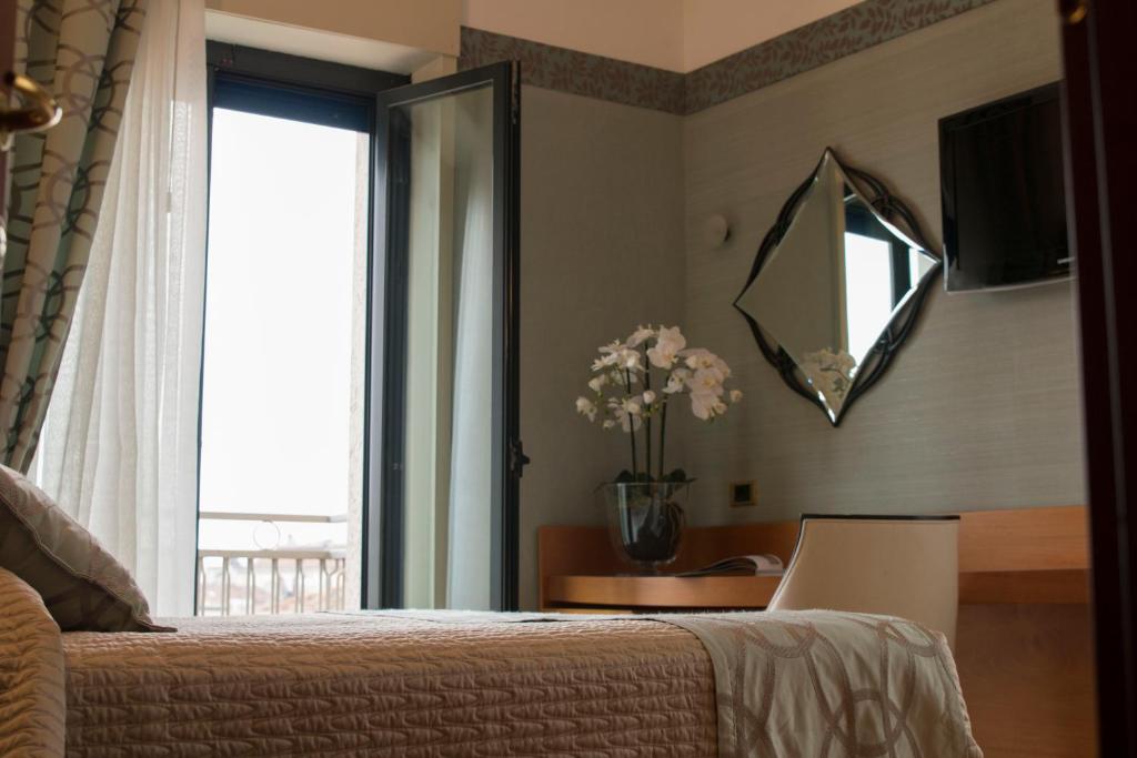 Postel nebo postele na pokoji v ubytování Hotel Europa